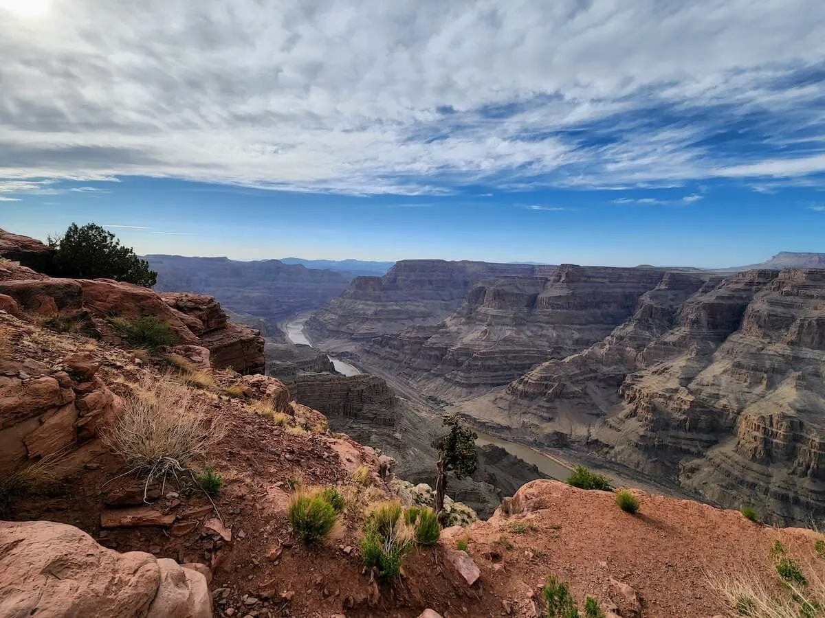 Quotes About The Grand Canyon Captions cover photo of the Colorado River winding through the bottom of the Grand Canyon Arizona